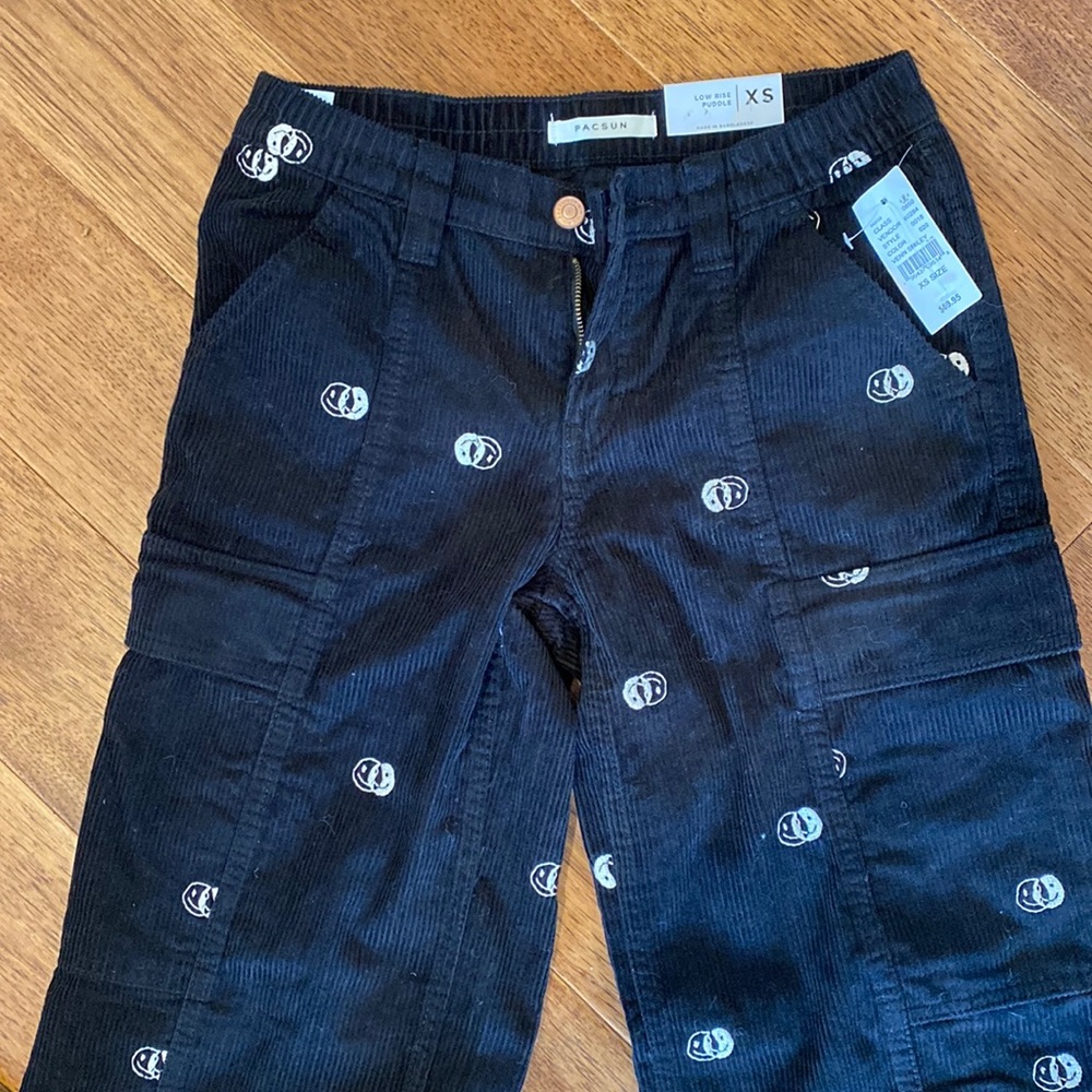 Brand new, y2k-style black corduroy cargo pants with smiley print